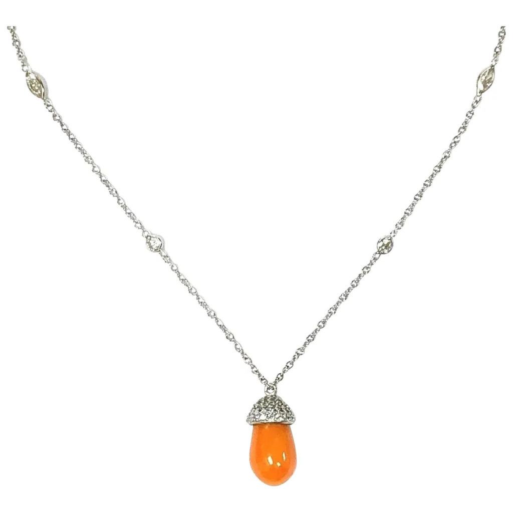Perle melo orange montée en pendentif